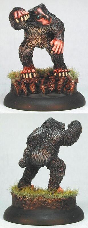 Painted miniature of a snarling badger monster on a grassy round base, front and back views
