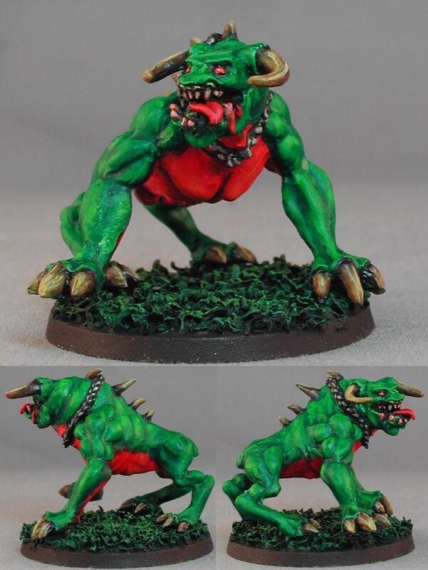 Painted miniature of a green horned monster shown from three angles on a gray background.