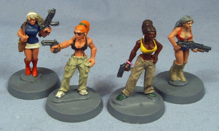Four painted sci-fi soldier miniatures posed on round gray bases.